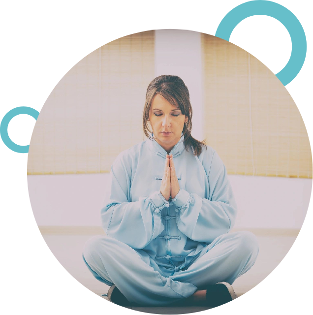 A woman sitting in the middle of a yoga pose.