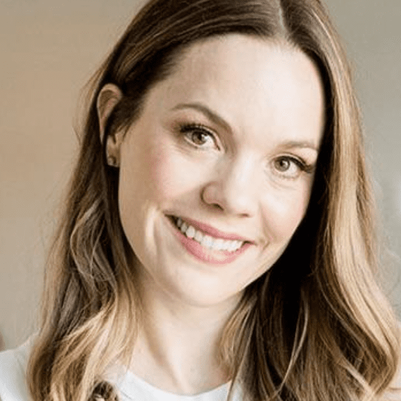 Smiling woman with long brown hair.